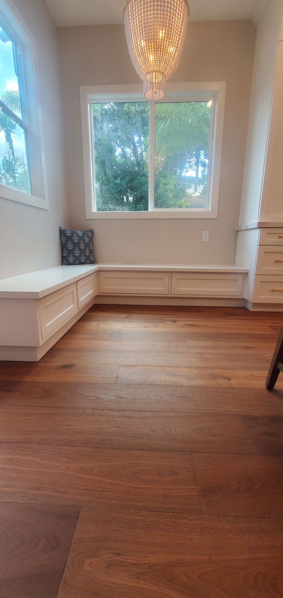 Custom cabinet refinishing project in San Diego — two-tone kitchen with navy lower cabinets and white uppers