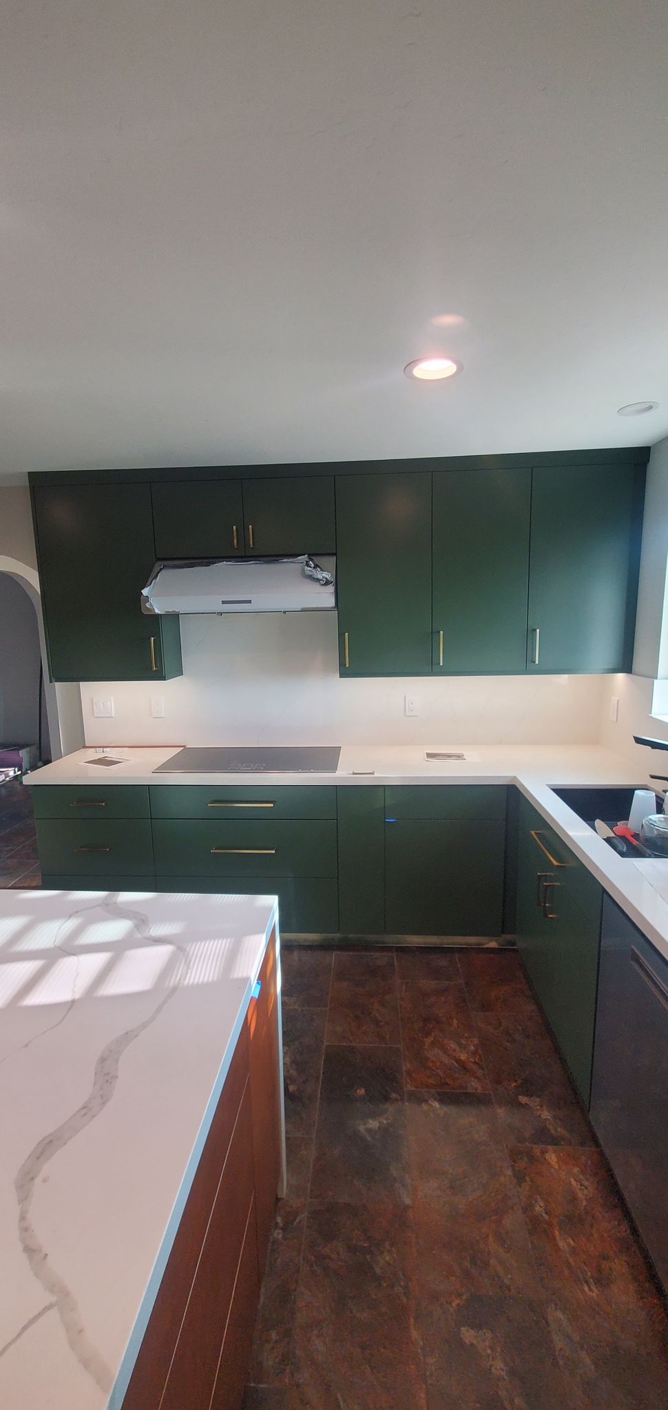 Kitchen cabinet refinishing in San Diego — updated color from stained oak to painted white shaker