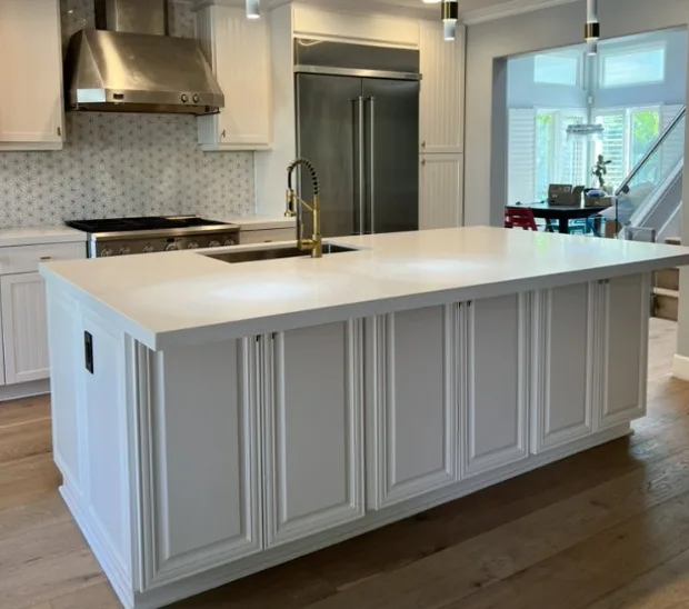 Estate kitchen remodel near Fairbanks Ranch with custom white cabinetry, quartz waterfall island, and integrated appliances — SD Remodel Experts