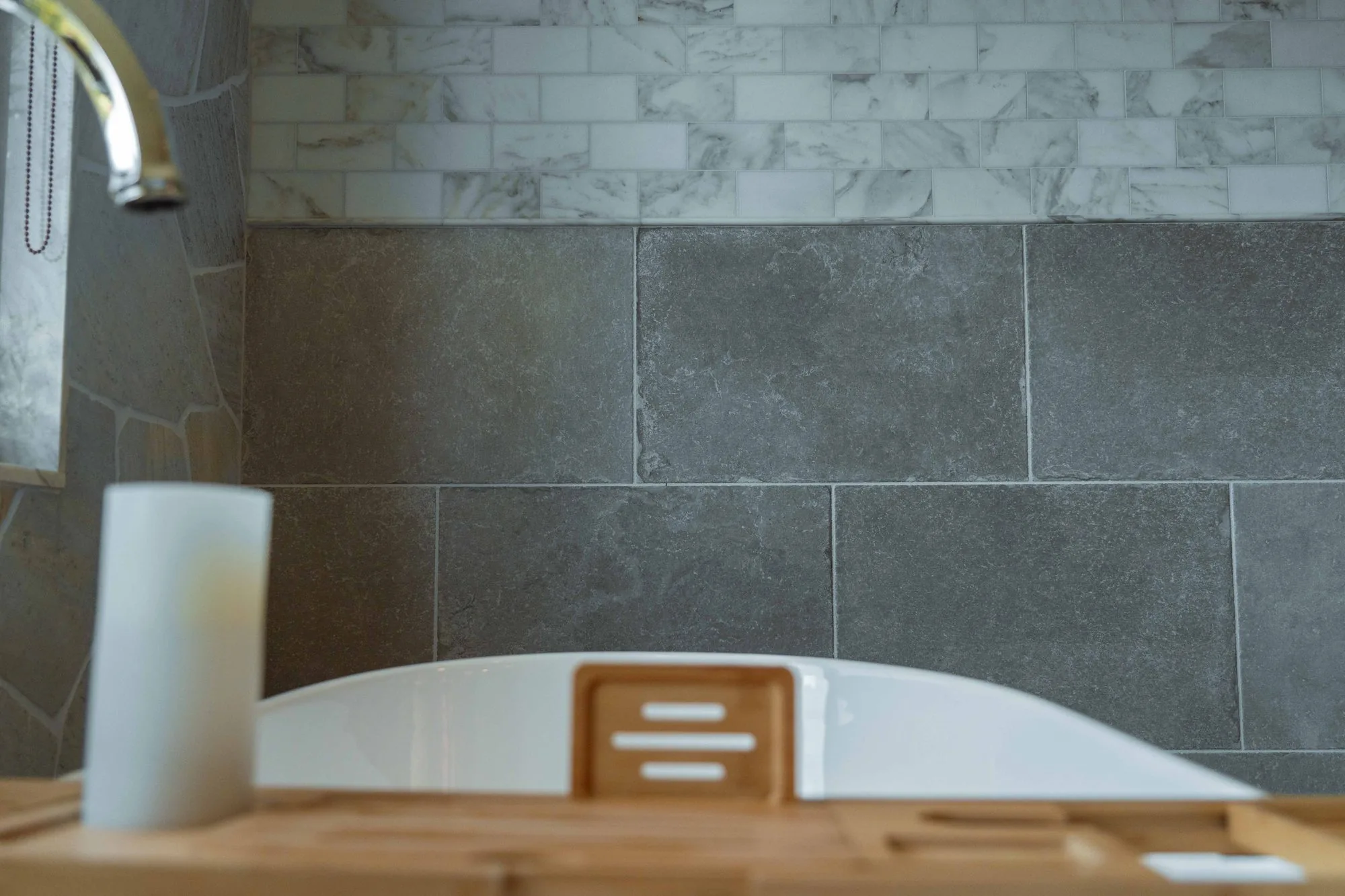 Spa-style bathroom remodel in La Jolla with soaking tub, custom vanity, and marble tile by SD Remodel Experts