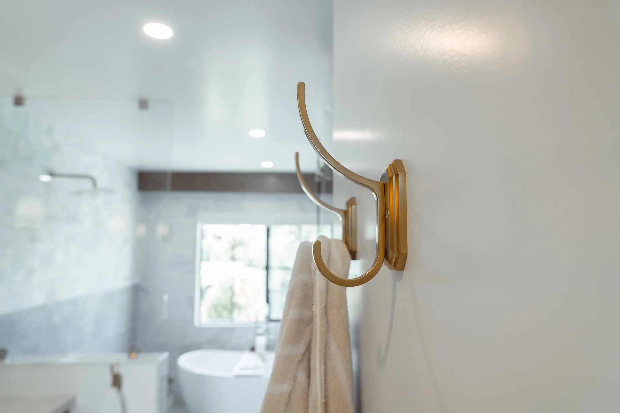 Luxury curbless walk-in shower with large-format tile in La Jolla master bath remodel