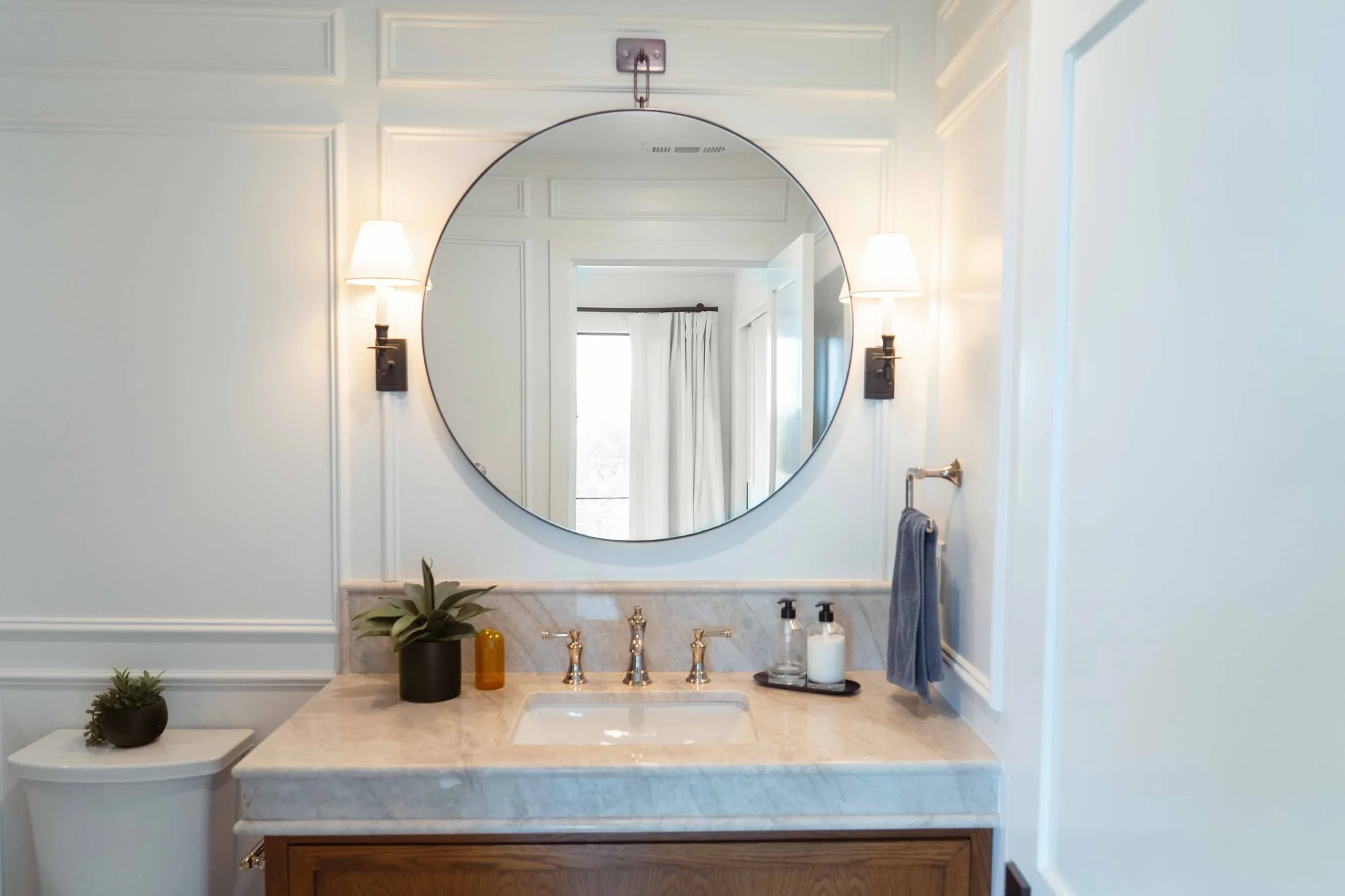 Powder room remodel in La Jolla with statement tile, floating vanity, designer fixtures, and custom mirror by SD Remodel Experts